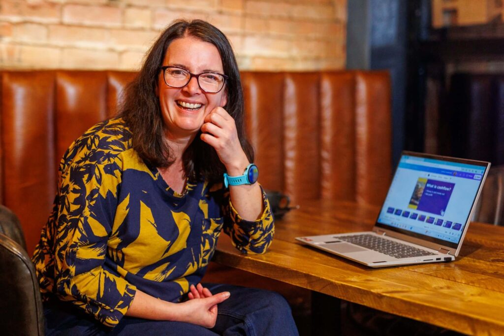 Sarah Hands working on her laptop